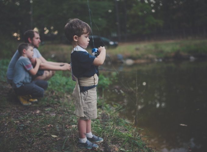 Boy Taking Photo at the Lake