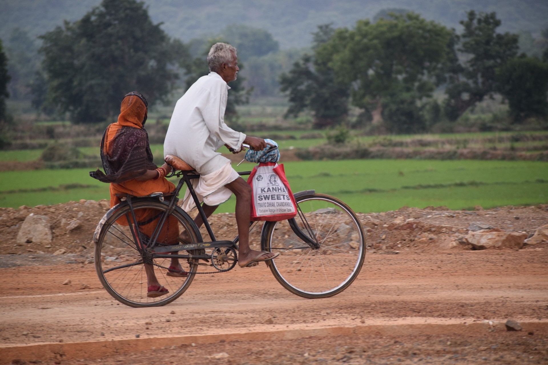 Old Couple On The Bicycle