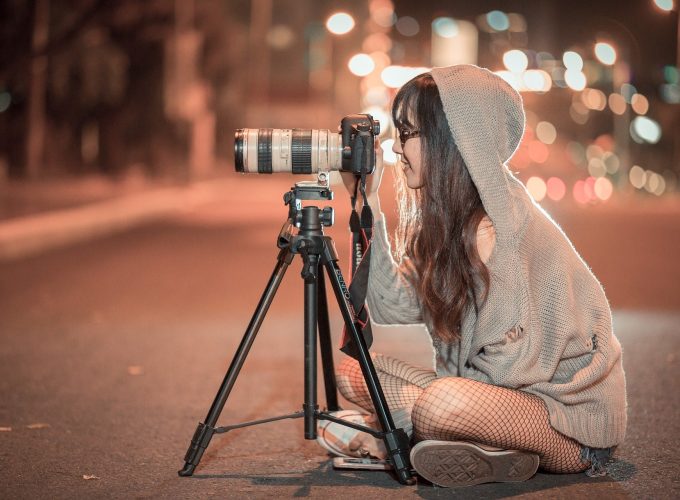 Tourist Girl Taking Photo at Night